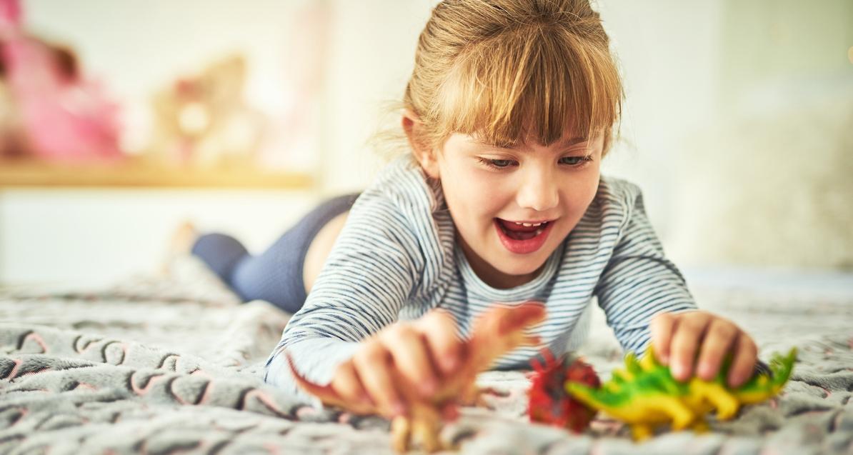 girl playing dinosaurs