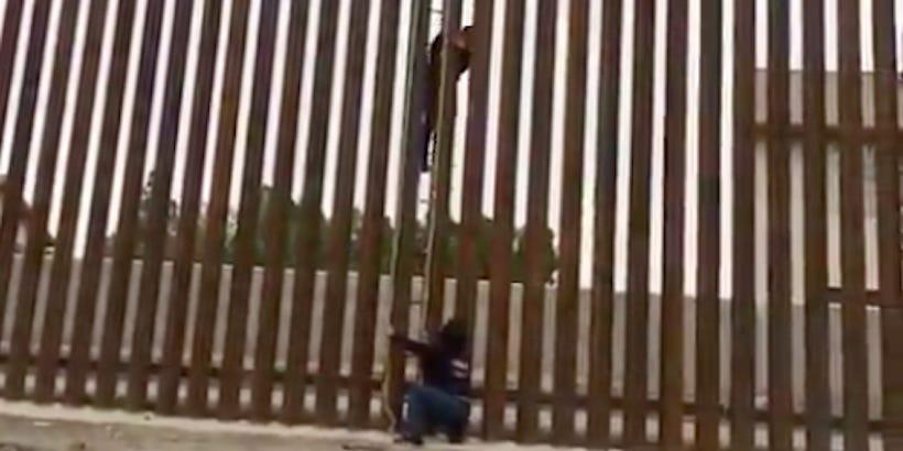 Video shows people climbing over Trump's new wall with a ladder and ...