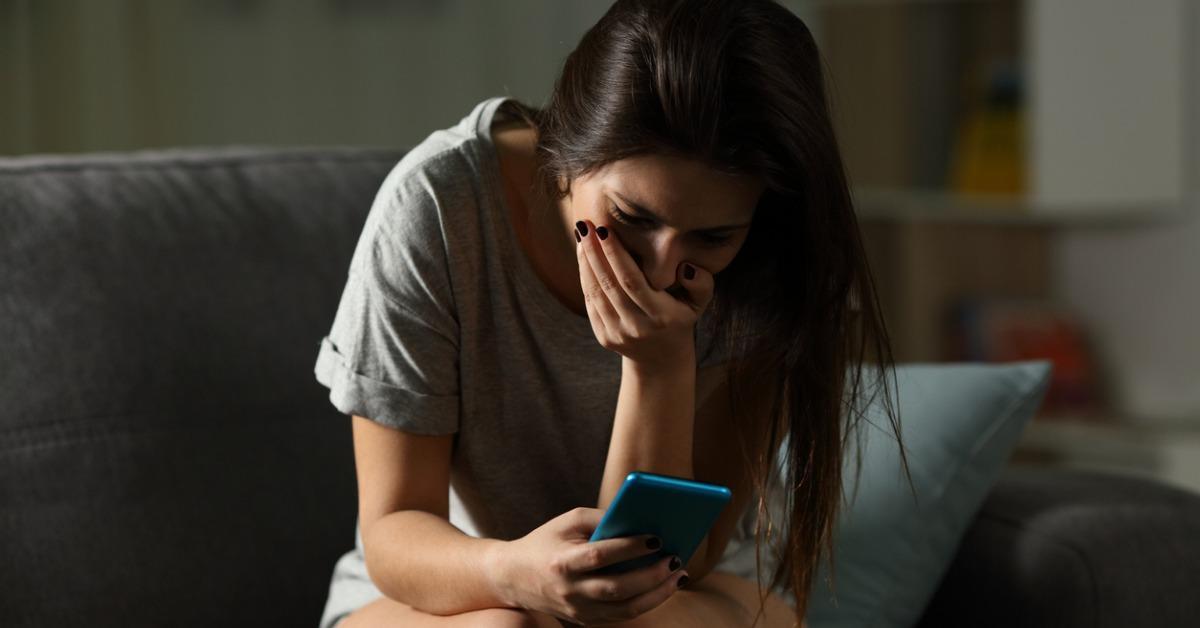 sad teen receiving bad news online at home picture id